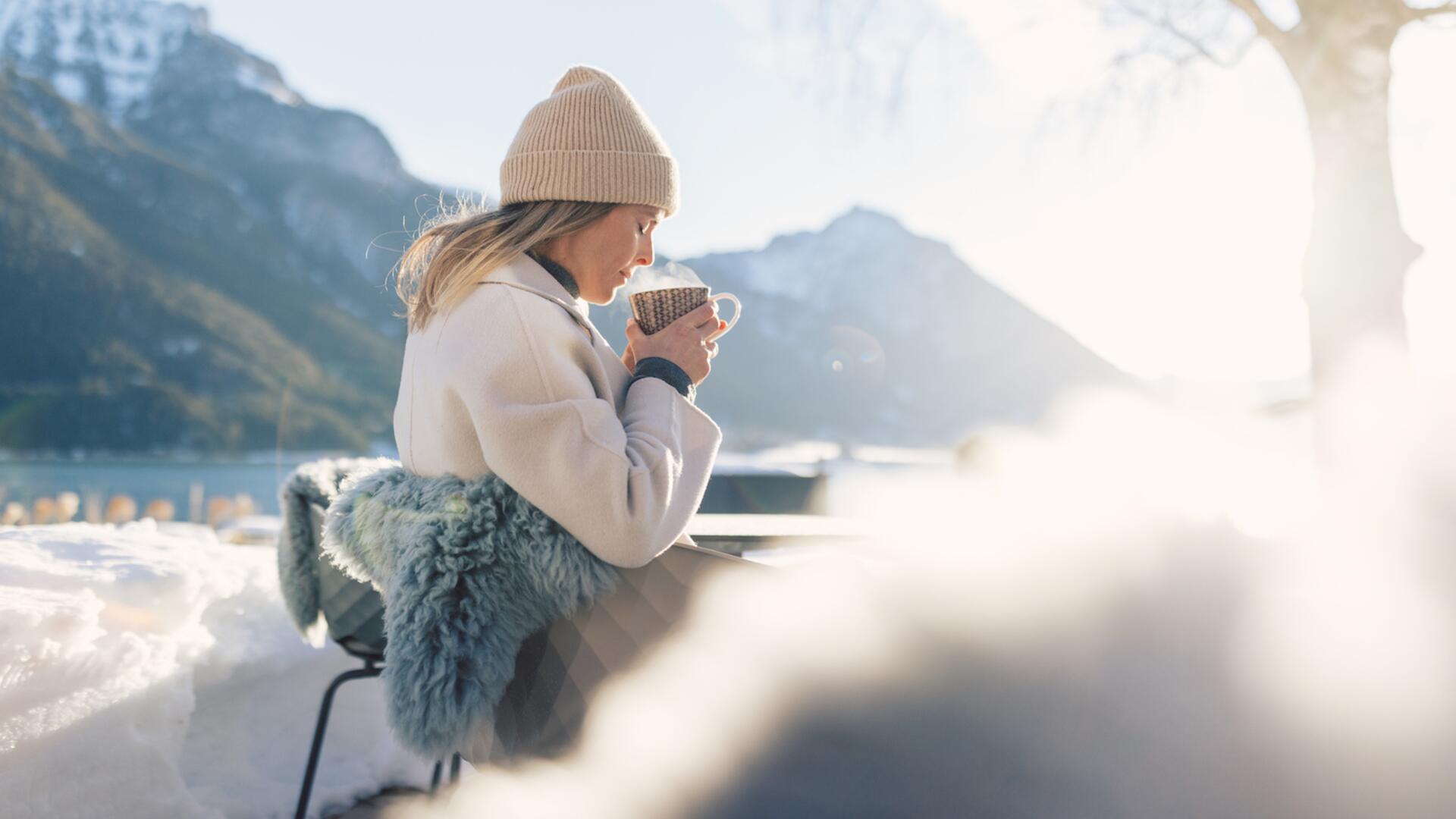 drinking coffee by the lake in winter