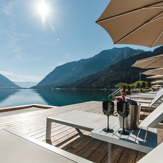 Sun loungers directly on the lake Achensee