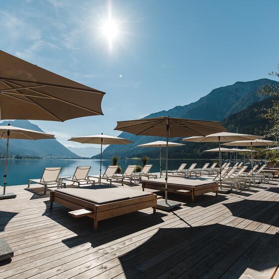 hotel with sun loungers by the lake